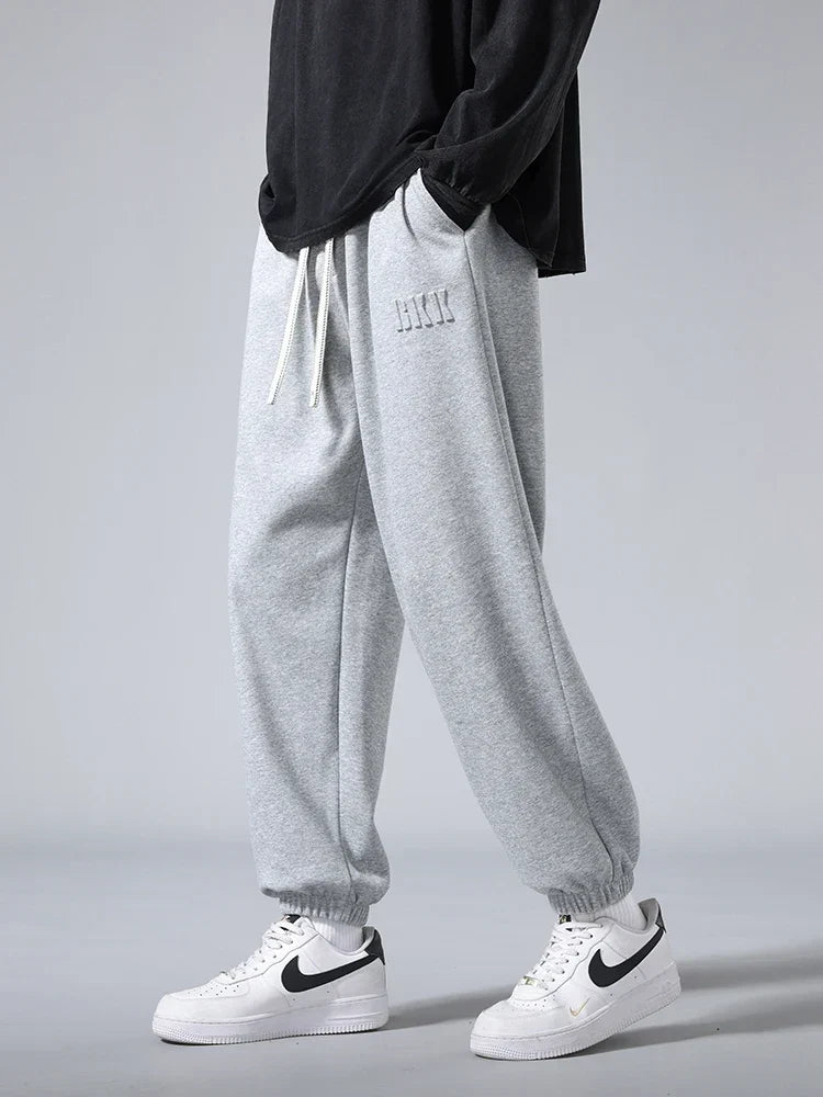 Pantalones jogger de punto hombre entallados con bolsillos amplios